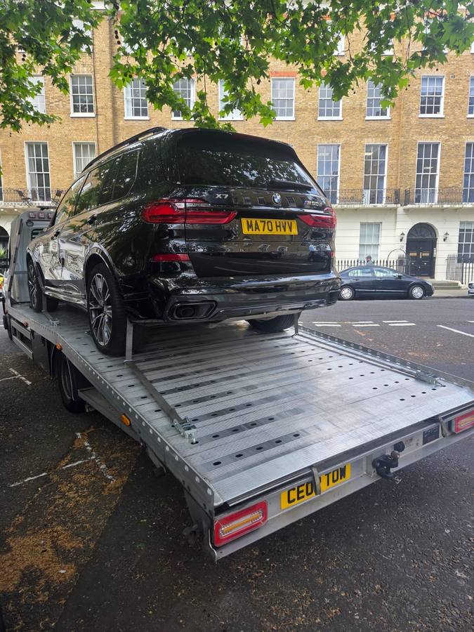 White Mercedes Sprinter van recovered and loaded on flatbed