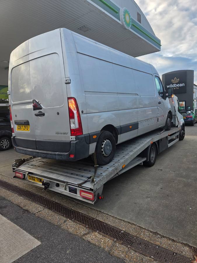 Light blue Mercedes commercial van recovered on truck flatbed