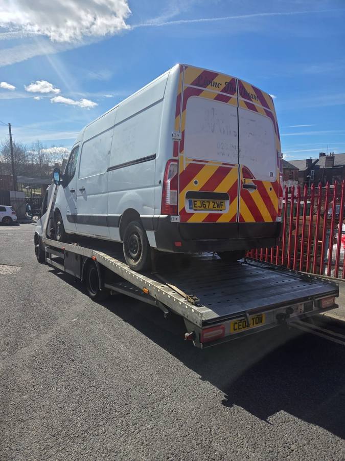 White van with red and yellow emergency markings on Tow 2 Tow flatbed